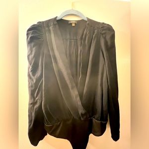 Black crossover, puff sleeves bodysuit. Never worn